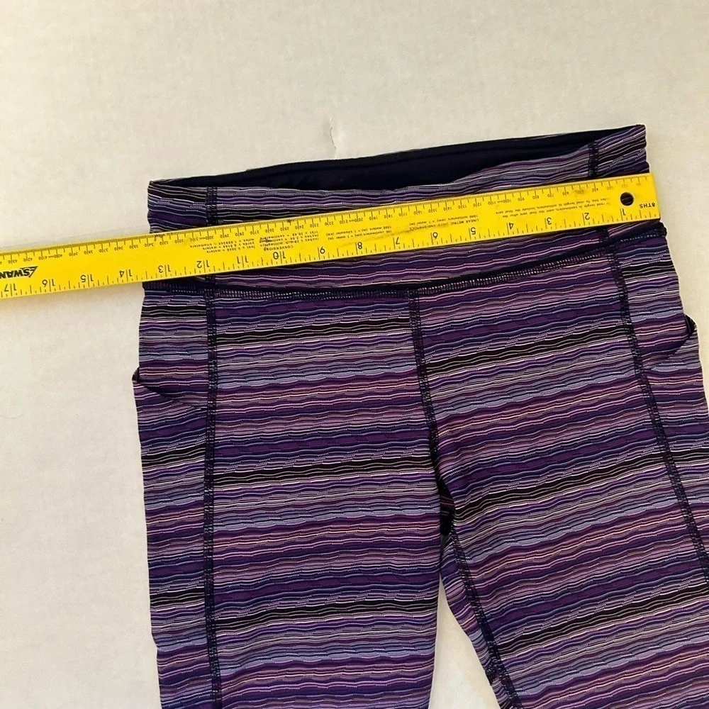 Lululemon striped purple legging w/back zip pocket & 2‎ side pockets Sz-6. Z19
